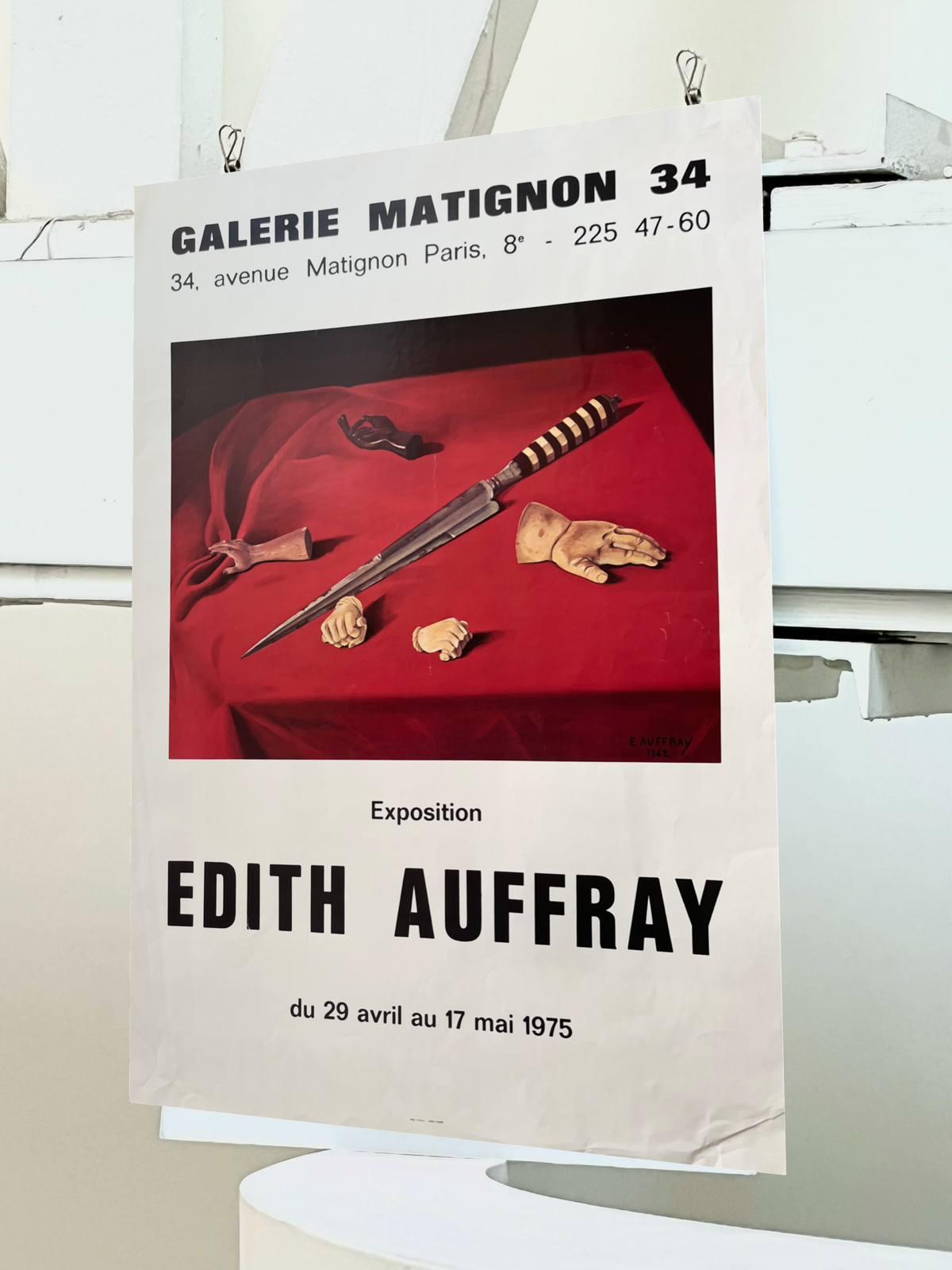 1975 Edith Auffray French art exhibition lithograph, close-up full view showing a bold red velvet scene with a blade and hand sculptures