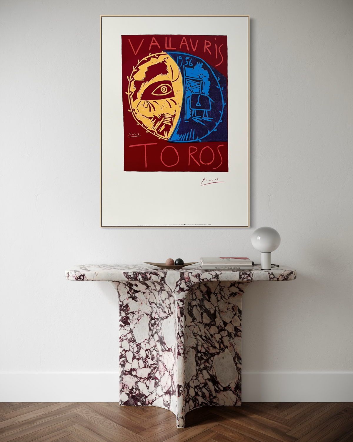 Vintage Picasso bullfight lithograph hung on a living room wall