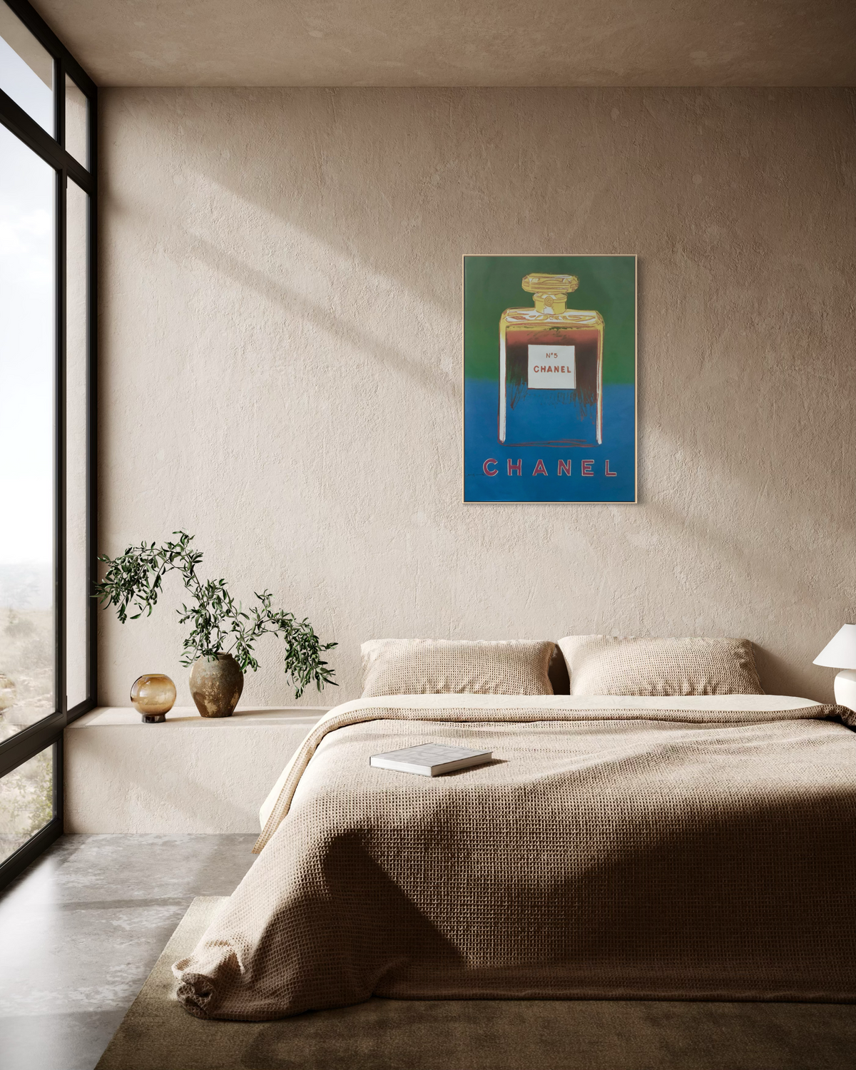 Andy Warhol blue Chanel No. 5 pop art poster hung on a wall in a styled room