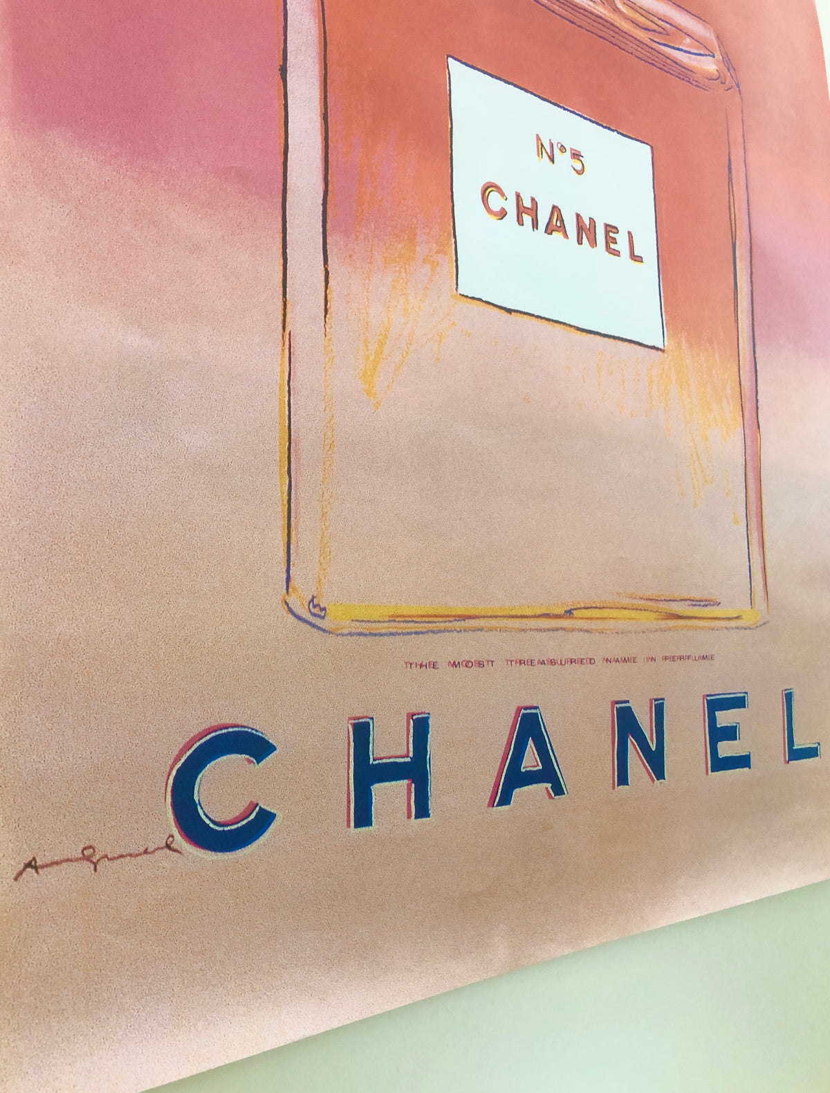 Close-up detail of the Andy Warhol Chanel No. 5 bottles showing the print texture