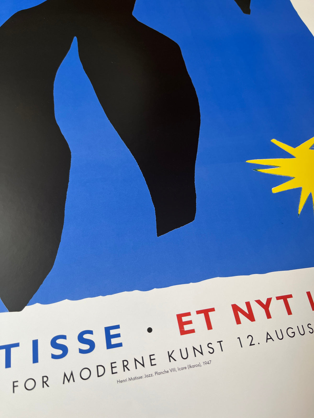 Close-up detail of the poster’s printed colors and texture